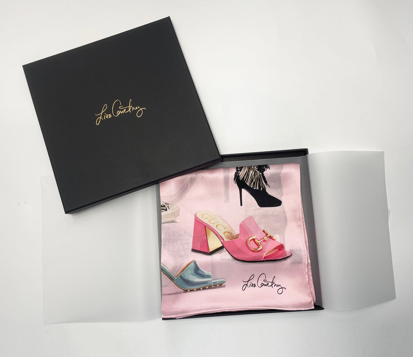  An image of the Designer Shoe Scarf by Lisa Courtney Designs that is folded, wrapped in tissue in a beautiful black box.